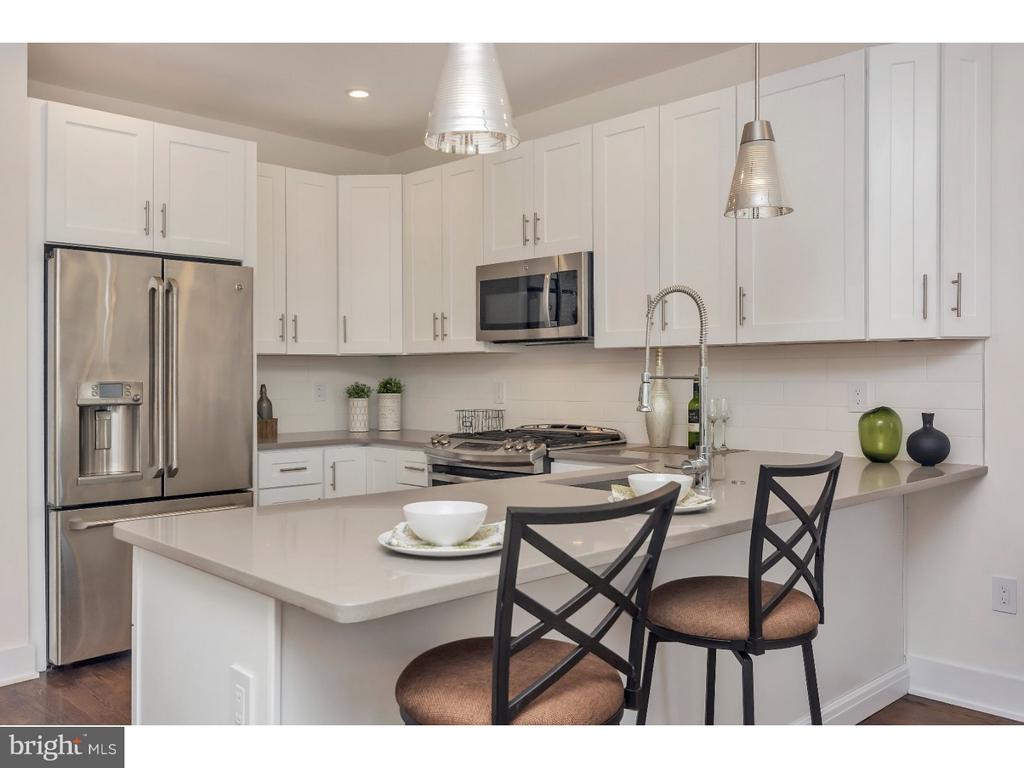 New Construction, Gated Community in Point Breeze with Parking!! West Point Estates is selling out now! Here is your opportunity to invest in a property within a desirable location at an unbelievable price! Located close to University City, Graduate Hospital & all major commuter routes. Unit 1 features a spacious, open & modern floor plan with 2 Bedrooms, 2 Full Baths and assigned parking.  The Kitchen overlooks spacious Dining & Living Areas that feature large windows for tons a natural sunlight. Streamline offers numerous Bathroom finishes as well as many upgrades to complete your home to your style & needs! The thoughtfully designed floor plan includes 2 large Bedrooms with plenty of closet space and a conveniently located Laundry Closet. Streamline is proud to offer our Buyers a 1-year Builders Warranty plus the 10 Year Tax Abatement Program! Schedule a  Virtual Tour today! **Condo Fees & Tax Numbers are estimates and are subject to change. Photos featured are from a recently completed Streamline project.**
