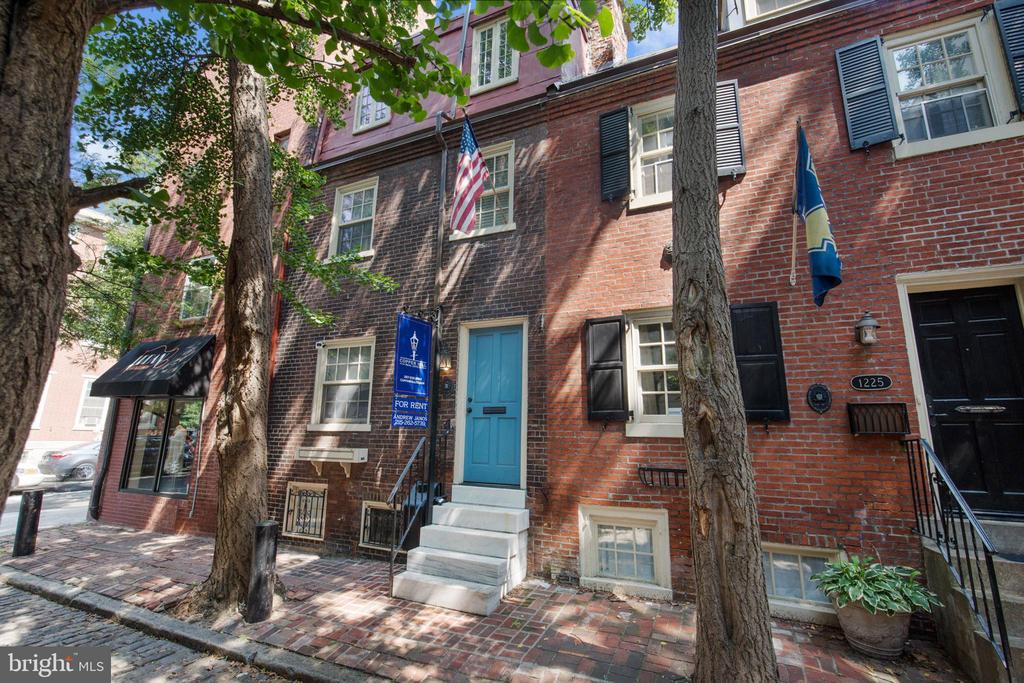 Welcome to Washington Square West! Close proximity to Center City, Midtown Village, Old City, Queen Village, and Rittenhouse Square. Walking distance to Washington Square + Rittenhouse Square, 13th Street Corridor, Old City Business District, and Independence Hall. Convenient to the Broad Street Line, Patco, and 11th St Train Station; as well as many convenient bus routes. Everything has been taken care of in this impeccably designed, classic, Philadelphia trinity, which comes with the following: 2 bedrooms; modern kitchen, plenty of counter space, storage, and natural light; one full bathroom on 2nd floor with elegant wainscoting. There is a great master bedroom with natural light, original hardwood floors, and ample closet space. This home also has a private rear sitting area, as well as a functional breezeway. The floor plan has hardwood floors throughout, tons of natural light, as well as easy living/entertaining options, where you can enjoy Philadelphia's four traditional seasons. You can choose to walk, bike, use public transit, or drive on a daily basis. This ideal + convenient location allows you to explore Philadelphia from all angles. 1227 Panama St provides a charming, historic lifestyle, with convenient access to Philadelphia's great restaurants, shops, and recreation!