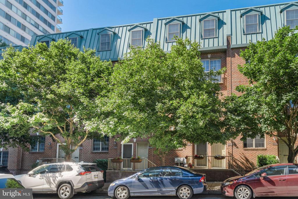 Rarely offered and highly desired, this B unit on the Wallace St side of Museum Commons houses 3 beds, 2.5 baths, over 2,200 sq ft of living space, and a private community driveway in the rear with 1-car garage parking!  Nestled on a tree lined street in the heart of Fairmount, this beautifully maintained home has a Walk Score of 93, and is a stone's throw away from many amenities, such as: Whole Foods, The Schuylkill River Trail, The Philadelphia Museum of Art, Fairmount Avenue's many shops/restaurants, The Barnes Foundation, and so much more.  As you enter your new home, you're greeted by an extremely spacious/bright living area with plantation shutters (a feature you'll notice throughout the home) that's great for entertaining and lounging.  Off the living room, is your modern kitchen with granite counters, stainless steel appliances, tons of counter & cabinet space, kitchen island, french doors, and plenty of space for a dining table. The kitchen area is complete with a powder room, as well as a separate laundry room with additional storage space. Up the steps you'll find two sizable bedrooms + a full bath.  On the 3rd floor is the master retreat, which includes awesome closet space, a bathroom oasis with double vanity, extremely large stall shower with rain shower head, & separate bathtub.  Additionally, this home has lots of closet space throughout and a basement area great for storage, working out, or a home office/studio, among other things.  Don't let this opportunity pass you by!