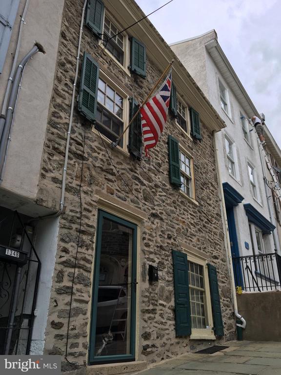 Beautiful stone townhome for rent in a superb Manayunk location! This is a rare opportunity to rent a home that is the complete package- antique charm on the exterior with a meticulously renovated interior. The living room features gleaming hardwood floors, tons of natural light from the front windows, and even a fireplace. The separate dining room is ideal for entertaining and leads to a beautifully updated kitchen with granite counter tops and top-of-the-line stainless appliances. A convenient half bath rounds off the first floor. From the kitchen, exit to the enclosed patio, perfect for enjoying a barbecue on summer evenings, and to the impeccably landscaped breezeway. The second floor features a full bath and a master bedroom with hardwood floors and an exposed stone wall. Two bonus rooms on this level can be used as offices, nurseries, or craft rooms. The third floor features three full-sized carpeted bedrooms, perfect for roommates, family, or guests. Incredible location only blocks away from Pretzel Park, SEPTA regional rail, and all Main Street has to offer.