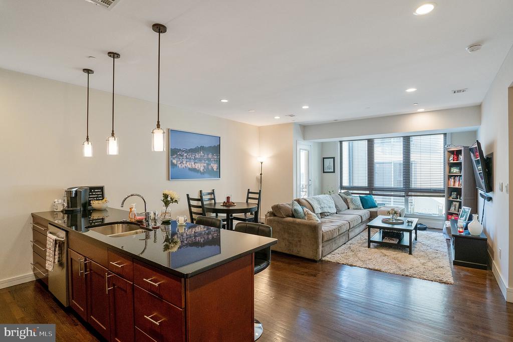 Own a 2BR/2BA condo with PARKING and TAX ABATEMENT in a highly sought after condominium community located in the heart of Kensington, within walking distance of Penn's Landing, Fishtown, Northern Liberties, & the Spring Garden MFL station. This is the ideal location for the savvy urban dweller looking for a permanent residence or a pied- -terre. Private community with gated entrance. This home features an open concept living space with a modern kitchen, spacious gathering room, floor-to-ceiling windows & walk out balcony. The kitchen boasts ample cabinet + counter space, stainless steel appliances & tile backsplash. Stroll through the well-proportioned living space, and out onto the private balcony to take in the city views. Master suite features a spacious layout, double door closet, walk in shower, & W/D in unit. This condo provides the ideal urban lifestyle + location that you're looking for. Quick walk to Frankford Ave with all the restaurants along with ones popping up on Front Street. This unit has years remaining on the TAX ABATEMENT creating a lower monthly payment for the buyer!