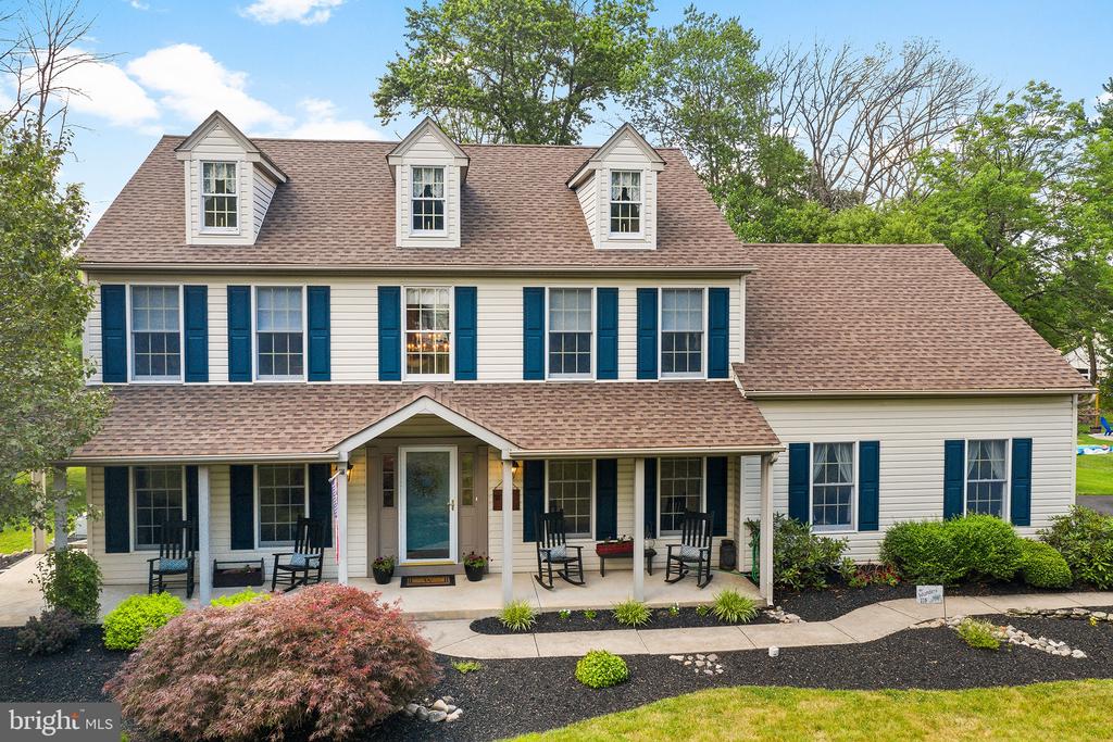 Welcome home to Addison Lane. This stunning home features 4 bedrooms, 2.5 bathrooms, and a fully finished basement, with an inviting outdoor living space on a tastefully landscaped half acre lot. The flawless and well-maintained landscaping is the first thing you'll notice about this property. Once through the front door, you're greeted by a bright and airy foyer and gleaming hardwood floors. To the right, you will find a large dining room ready for entertaining, with beautiful wainscoting and large windows that fill the room with natural light. Off the foyer to the left, is a light-filled and spacious formal living area. More wainscoting leads the way to the kitchen, which offers a spacious island, ample cabinet and pantry storage, a breakfast area with beautiful views of the backyard, plus a separate bar area that makes entertaining a dream. The kitchen flows into the large family room, complete with custom built-in cabinetry and a wood-burning fireplace surrounded by stone. From the kitchen and family room, a set of beautiful French doors leads you to the recently renovated 16x16 screened-in porch with steps down to a custom, 16x20 stamped concrete patio and walkway. It's truly a private oasis that is perfect for dining, grilling, and entertaining all summer long. Rounding out the first floor is a mud room/laundry room with access to both the spacious 2-car garage and driveway, as well as a convenient powder room. On the second floor, you'll find 3 bright and spacious guest bedrooms and a beautiful, brand-new hall bath with dual vanity. The large Owner's Suite boasts an impressive walk-in closet, a separate office space, and a stunning ensuite with a seamless glass walk-in shower, custom tile, large free-standing soaker tub, and dual vanity. The basement is fully finished, offering tons of extra living space to the home. In the last 5 years, this home has had a brand new driveway and roof installed, as well as a new HVAC system to be installed this month.  Amazing location, beautiful lot, incredible outdoor space -- this home has it all!