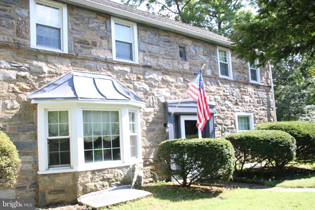 This home is located  in prestigious Lower Merion is worth much more than the listing price. But we know, too, that you are going to want to do some updating to make it YOUR home and so we priced it accordingly. Central air with 2 zones provides energy efficient air conditioning, walk through the secret garden and be welcomed by your new home a  3 story classic stone home.  Beautiful detailed mill-work in the living room and dining room, hardwood floors flow through  the first floor. The large  living room has lots of natural light and is a perfect spot for gathering with friends and family as you sit in front of the fireplace. The living room opens to a large side yard and patio. A powder bathroom on the first floor just off the eat in kitchen.  The second floor with 4 bedrooms and 3 full baths. front stair case and back stairs leading from the kitchen.  The 4th bedroom is perfect for an in-law or guest suite with its own full private bathroom.  The semi - finished basement is home to the laundry and provides an abundance of room for storage, playroom and options for wet bar and entertaining.Located in Award Winning Lower Merion School District. Close to shopping, dining, public transportation, Philadelphia International Airport and walking distance to several places of worship.
