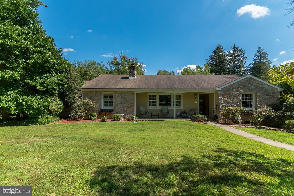 Beautiful rancher on a large .77 acre lot. This scenic property is in an ideal location and truly one of a kind. Enjoy the privacy and views of the property from your large multi-level deck off the back. Plenty of natural sunlight throughout the home with a large, renovated, eat in kitchen.  Take in the light and view from the large windows lining the back of the house.  The master suite has vaulted ceilings and custom stone and tile in the bath. Enjoy company of friends and family in the large and versatile family room with a built in fireplace.  Downstairs has an additional family area or space that could be turn it into an exercise room, crafts area, or even an additional bedroom.  With a two car garage and 5 total spaces there is plenty of room for friends or family members. Enjoy all the nearby local parks, shopping and that Huntington Valley and other surrounding communities have to offer.  This property is being sold "as is". (Agent is related to seller. )
