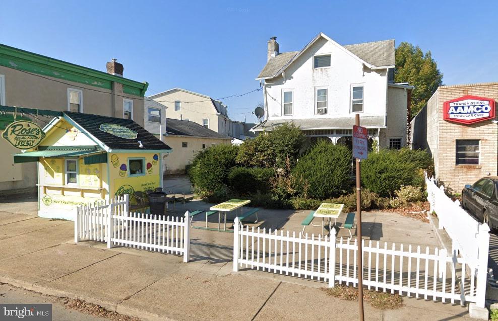 Calling all savvy investors! Great mixed-use building for sale consisting of a 5 income producing units.  Water ice stand, stand-alone home, 2bd/1ba apartment and two garage spaces.  Extra outside parking that could bring in additional revenue as well!  Priced to sell!