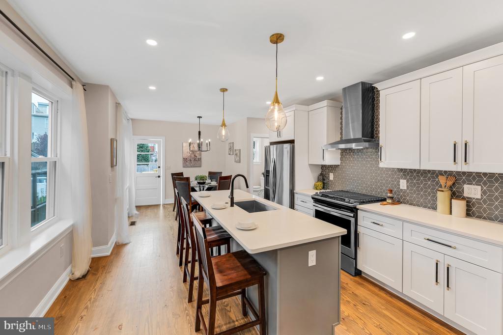 Welcome to Roxborough, and to 318 Fountain Street! Close proximity to Manayunk, Chestnut Hill, Fairmount Park, Center City, Conshohocken, and King of Prussia. Walking distance to Gorgas Park, Main Street in Manayunk, Ridge Avenue Business District in Roxborough, and the Ivy Ridge Train Station; as well as many convenient bus routes along Ridge Ave. Everything has been taken care of in this fantastic, 2-story, red brick, Philadelphia straight-through twin home, which comes with the following: Great room connected to a modern/open kitchen; enclosed front porch; dining area; modern half bathroom on 1st floor; modern full bathroom on 2nd floor; 3 spacious bedrooms; awesome back deck and fenced-in rear yard. This home also features coveted 2 car parking through the rear alley! The amazing kitchen features quartz countertops, large island, stainless steel appliances, tile backsplash, and an open/light-filled workspace. The modern floor plan has hardwood floors + great natural light, as well as easy living/entertaining options, where you can enjoy Philadelphia's four traditional seasons in the rear yard or through opened windows on your enclosed front porch. You can choose to walk, bike, use public transit, or drive on a daily basis. This ideal + convenient location also allows you to walk, run, and bike on the Manayunk Tow Path, or directly into the lush green trails of the Wissahickon Valley, just minutes from your front door. 318 Fountain Street provides a charming, historic Main Street lifestyle, with convenient access to Philadelphia's great restaurants, shops, and recreation!
