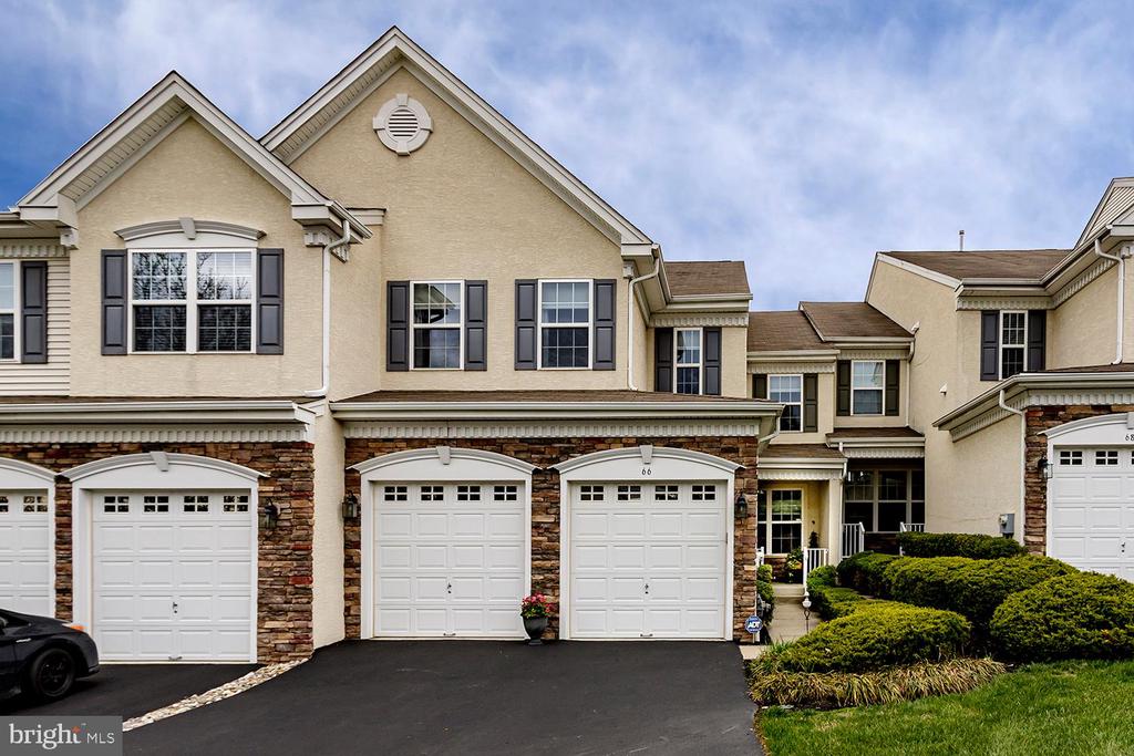 Welcome to 66 Wharton Drive located in the desirable Greenbriar II at Thornbury.  This popular and spacious Monroe model has 3 bedrooms 2 full baths and 2 half baths.  The first floor boasts an open floor plan with the highlight being the beautiful two story family room that leads into the gourmet eat-in-kitchen.  With 42" cabinets, granite countertops, double wall oven, double panty and more this kitchen has it all.  Just off the kitchen you will find a 20x16 foot trex deck that faces open space surrounded by wooded grounds.  A truly serene and private oasis not often found in this neighborhood.  Upstairs you will find a master bedroom with an en suite bathroom, two walk in closets and an oversized bathtub as well as two additional bedrooms and a full bath.  The finished basement has been beautifully done with hardwood floors throughout.  Aside from a large second family room there is an office with glass french doors and a half bath with an upgraded vanity and lighting.  All of the lighting throughout the house has been upgraded including a beautiful architectural fan in the family room.   Do not miss out on this one of a kind opportunity to own a beautiful home in Greenbriar II.