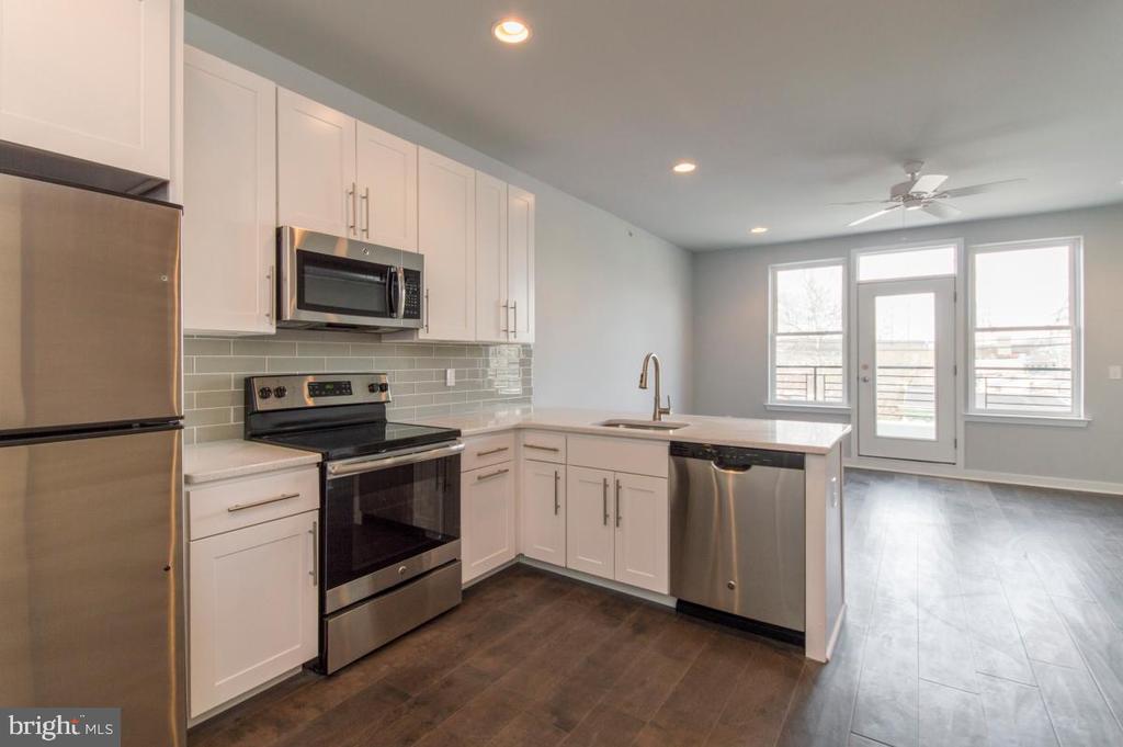 Hardwood flooring throughout the open living and dining room space showcases the modern kitchen featuring stainless steel appliances, quartz counter-tops & pendant lighting. Off the living room you will find your own large balcony. Washer and dryer in the unit. Shared rooftop with panoramic views of the city. Just steps away from Main Street, Manayunk train station, Pretzel Park and fantastic restaurants, caf s and shopping. Parking Garage available attached to property at an additional cost. First, last and security needed to move-in.