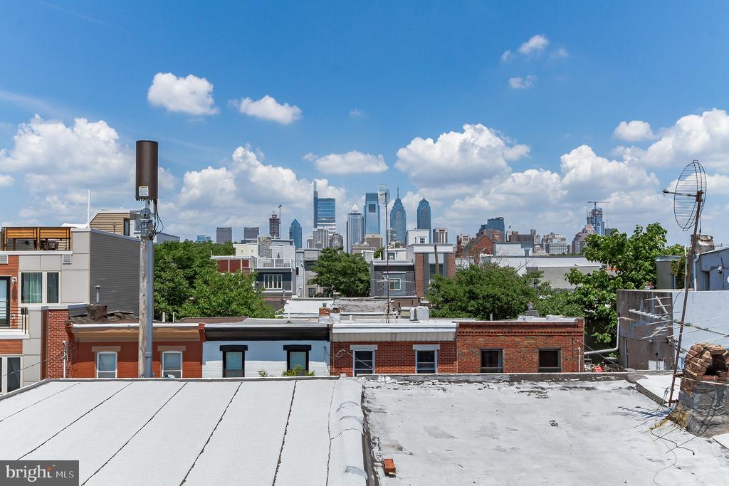 A Once in a Lifetime Opportunity to own this stunning Renovated Corner Property with TWO-CAR GARAGE, Roof Deck, and Tax Abatement!!! This beautiful, extra wide home includes: 3 bedrooms, 2 and 1 Half Bathrooms, TWO-CAR GARAGE (can't say it enough), Finished Basement, 2nd Floor Outdoor Patio PLUS Rooftop Deck with amazing city skyline views. Since the property is located on a corner and has 18 windows, this home offers tons of natural light. The First Floor includes a spacious and bright open floor plan with 11-Foot Ceilings, Living Room, Dining Room, Bathroom and a Gourmet Kitchen with Samsung Stainless Steel Appliances, white Quartz Countertops, Custom Espresso Cabinets, an Extra Wide Stainless Steel Sink and Glass Backsplash. Second Floor includes a large Master Bedroom Suite with beautiful Bay Windows and a Ceiling Fan, Large Closets and a luxurious Master Bathroom with Frameless Glass Shower Doors, Double Sinks and an additional large Storage Vanity. Walk down the hallway to find a second beautiful Full Bathroom and 2 Large Bedrooms each with Ceilings Fans and Large Closets. Exit the Second Floor Rear Door onto a beautiful Patio and a Spiral Staircase leading up to the Roof Deck with stunning panoramic views of Philadelphia. But where else are you going to get a 2 Car Garage! This home also has Phillips Hue Lighting, Nest Thermostat, Ring Doorbell, Elfa Closet Organizers, Hardwood Floors throughout, Spacious Finished Basement, and an Extra Finished Storage Space with Samsung Washer and Dryer. You will also enjoy the remaining years of the tax abatement. Schedule your showing now before it is too late. This home won't last long!