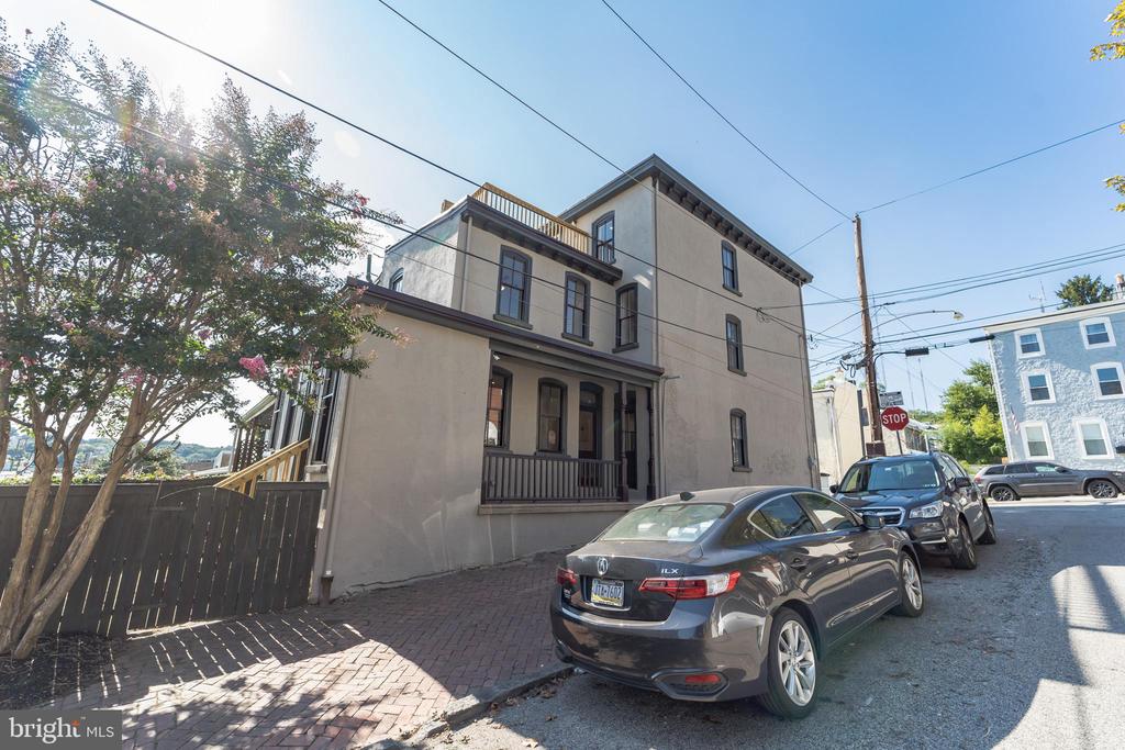 Welcome to this newly remodeled corner twin located in the heart of Manayunk! Masterfully brought back to its former glory by Studio Torres Development, this home maintains original charm and character while incorporating all of the amenities of a modern home. Enter through the foyer past the elegantly restored stairway and original curved wall into the grand main floor, which features high ceilings, original trim and crown molding, huge windows, and magnificent pocket doors that separate the living and dining rooms. The modern kitchen includes stainless steel appliances, gas range w/ pot filler, quartz countertops, and custom cabinets. Just off the kitchen is a half bathroom and mudroom (which could double as a WFH space), which leads to a fenced-in back yard, perfect for grilling and entertaining. On the second floor, you will find 3 bedrooms with plenty of natural light and ceiling fans. The third floor features the main bedroom, en suite bathroom with double vanity, and a walk in closet.  Last but not least, enjoy stunning 360 degree views from the incredible roof deck! Holy Family's classic architecture to the west, rolling Manayunk/Roxborough hills to the north, Center City's skyline to the east, and suburban, green-covered hills to the south; just amazing. Just a short distance from Manayunk's popular Main Street, you can find great stores and restaurants including Taqueria Feliz, Volo Coffeehouse, Palm Tree Market, Jtown Hot Yoga, Dog Bakery, Manayunk Brewing and more! Also conveniently located near various public transportation routes, including rail and bus lines. Enjoy the outdoors by taking a walk/bike-ride along the Schuylkill River Trail or through the nearby parks. Don’t miss out on this tastefully renovated home in a fantastic, walkable location – schedule a showing today!