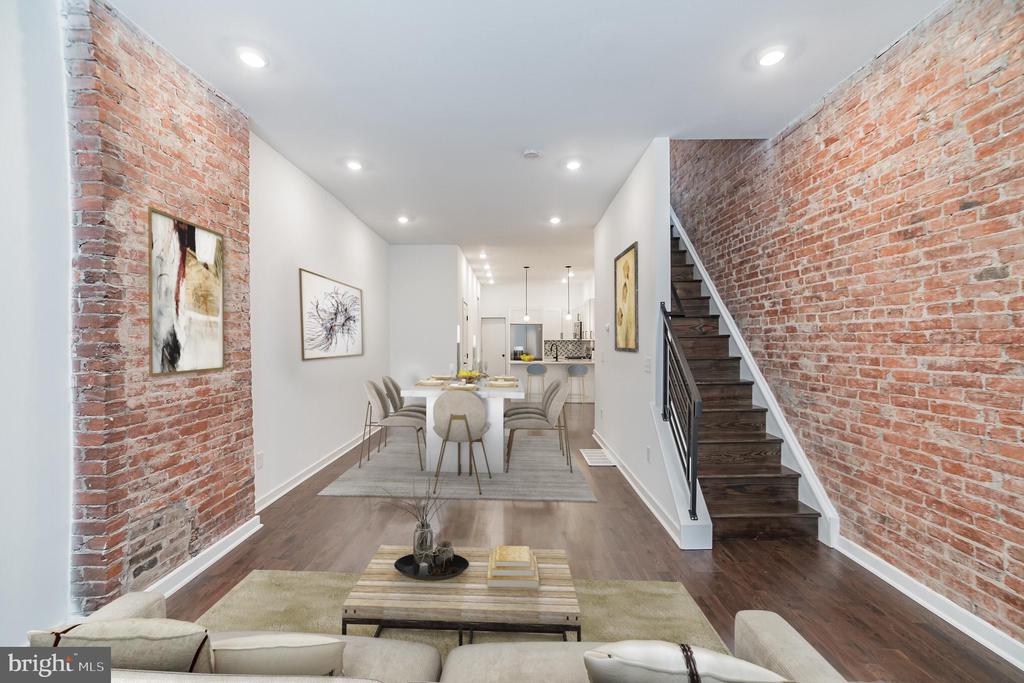 Welcome to this completely remodeled home located in the booming Brewerytown neighborhood! Enter through the covered porch into the open living space, which features stylish hardwood floors, recessed lighting, high ceilings, and a modern kitchen with quartz countertops, tile backsplash, soft-close cabinets, gas stove and stainless steel appliances. Exit the kitchen onto your private, fenced-in patio, perfect for barbequing and entertaining! The upper level includes 3 spacious bedrooms with, as well as 1.5 bathrooms with custom fixtures and floor-to-ceiling tile. The primary bedroom includes a large closet and plenty of natural light!  The basement is partially finished and offers plenty of additional living space with high ceilings. This property includes a 10-YEAR TAX ABATEMENT! Conveniently located near various public transportation routes and along the popular Girard Ave shopping strip. Within walking distance to popular places, including The Philadelphia Art Museum, Whole Foods, Target, Fairmount Park, Monkey and Elephant coffee shop, Angelino’s, and Eastern State Penitentiary. A newly remodeled home, in a booming location, near various amenities, and with a tax abatement! Don’t miss out – schedule a showing today!