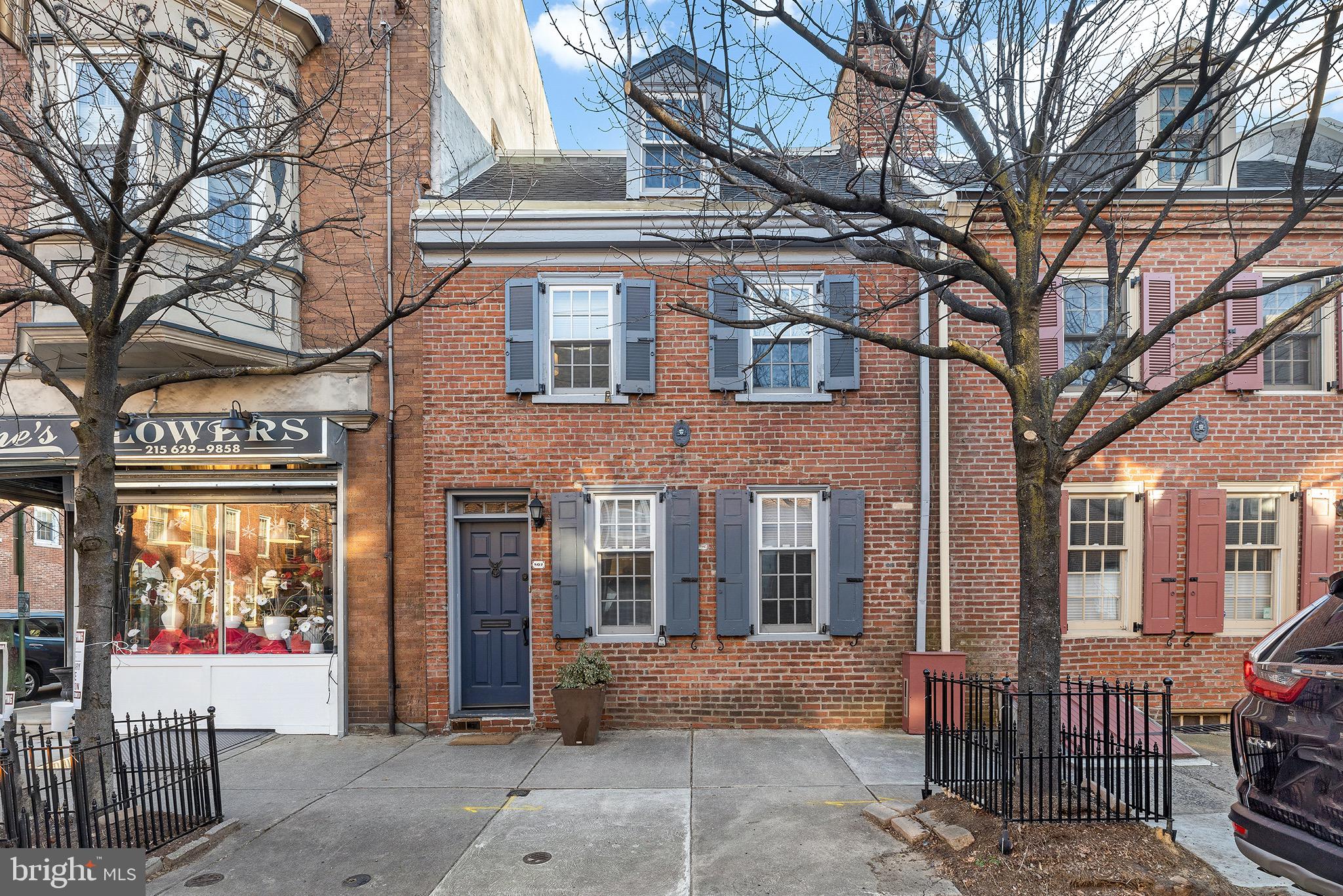 Welcome to 802 Lombard St. A beautiful 3 bed 2.5 bath home with a large outdoor space on the Philadelphia Register of Historic Places. Boasting an 18 ft wide open floor plan, with a finished basement and private outdoor space you will easily be able to accommodate family & friends!  Located steps away from all that Washington Square, Queen Village, South Street, and the Italian Market have to offer, including shops, groceries and hospitals. Walk inside the first floor where you’ll find the living room and 12-foot window framing the living wall on the back patio. Head downstairs to the family/dining room, half bath, laundry and plenty of custom storage under the stairs. The kitchen was fully renovated in 2021 with Shaker cabinets, recessed lighting, and stainless steel appliances. On the 2nd level you’ll find 2 bedrooms (one is currently used as an office) and a full bath. The third level is the master suite including plenty of storage in two large dormer closets. No need to feel the stress of having to do any major updates as this is move-in ready! Hard wood floors throughout the home have been meticulously maintained. A new furnace and air conditioning unit were installed in 2018 and every window and exterior door were replaced for energy efficiency in the last 4 years. Updated electric and lighting fixtures throughout the home were done in 2020 and are included. New roof in 2017. Book your showing today!