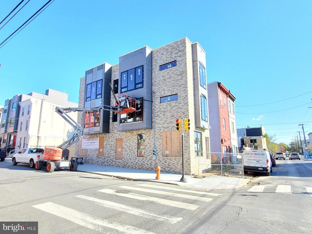 NEW CONSTRUCTION!  Brand new Duplex in the booming 19122 zip code. Close proximity to Temple University and the Septa Regional Rail to Center City. Amazing investment opportunity for a turnkey multi-family property ready to lease immediately! There are many new projects within a 2 block radius that will add to the already blossoming region. Tenants will enjoy the privacy and security of separate entrances to each unit. Unit 1 is a ground floor and lower level with 2 bedrooms and 2 and a half baths. Enter from the private rear patio or through the side entrance to the unit off of N 9th Street. The main level boasts a modern kitchen set up as well as a large living room area for entertaining! Both bedrooms in Unit 1 are located on the lower level with tall ceilings and ample recessed lighting and windows. Unit 2 is situated on the second and third levels of the building and showcases an expansive roof deck with unimpeded views of the Philly skyline! The extra large windows on this corner property allow the natural sunlight to flood into the units! The building comes with a 1 year builder's warranty. **Property is currently under construction with a Spring delivery date. The finish photos are from another recently completed project by the same builder on the block.