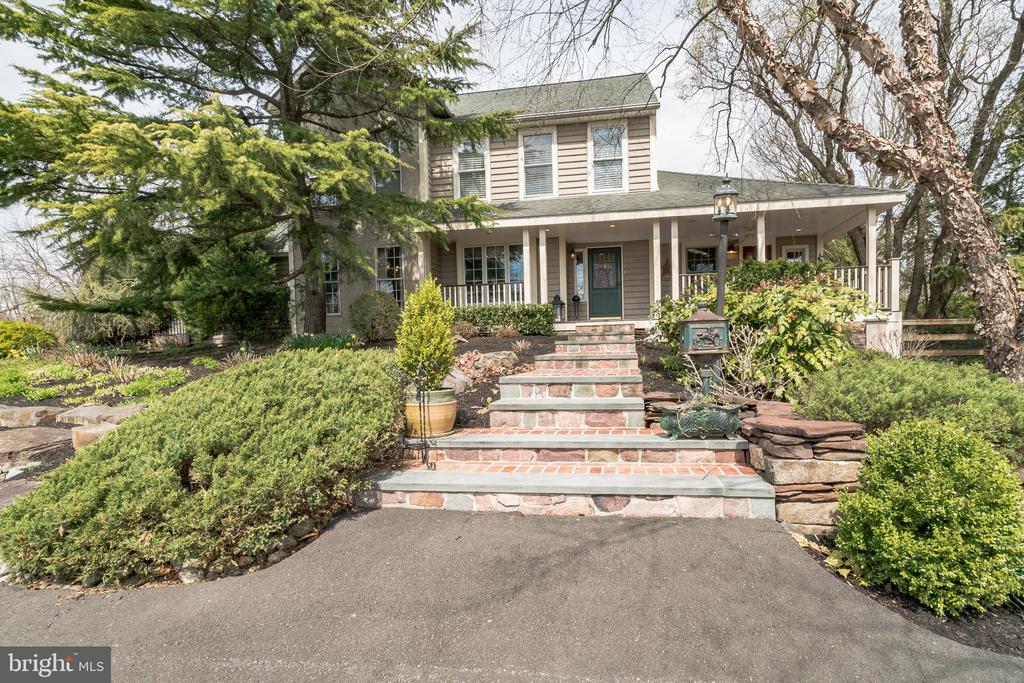 Welcome to 756 Swamp Rd, an immaculate southern farmhouse style home in the award-winning Council Rock school district.  Enter the extended driveway to the peaceful and tranquil private manicured grounds with cherry plum trees lining the driveway.  The landscaping/ hardscaping is immaculate with a vast variety of plants specifically designed to always have something blooming, also attracting a large variety of birds.   A horticultures and bird watcher’s dream.  This property is overflowing with details, down to the repurposed stone all around the property and on the exterior from old Bucks County stone barns and homes.  Enter the home up the garden brick walkway to the front porch, perfect for rocking chairs and sipping iced tea on those warm summer days.  Off the foyer to your left, enter your home office with built in cabinetry which leads into your formal dining room which also has built in cabinetry.   From the Formal dining area, enter into the large kitchen and breakfast nook which opens to the great room.  The kitchen features tile floor and backsplash, a unique Lancaster County farmhouse built in hutch, circa 1860’s, stainless steel appliances, peninsula counter with seating and quartzite counter tops.  Open concept kitchen and great room with wood burning stove fireplace and huge windows overlooking the scenic backyard.  From the great room, enter the formal living room, with a gas fireplace and vaulted ceilings.  Also on the first floor is a powder room, bedroom, mud room, laundry room and side entrance with covered porch.  Downstairs you will find a fully finished basement with half bath, perfect for entertaining.  It is an additional 2,289 sq ft with endless possibilities.   Upstairs, enter the primary suite which features an updated bathroom with walk in shower, radiant flooring, and double vanity sink.  There is also a large walk-in closet and an additional bonus space currently being used as a gym area.   Also, upstairs you will find 3 more spacious bedrooms with ample closet space and a full bath with double vanity sinks.   Other features of the home include a long driveway with ample parking, pole barn, central vacuum system, Sprinkler system, water softener system and 2 zone heating and A/C.  Step outside to your private garden oasis with beautiful landscaping and in ground saltwater pool.   There is also a built-in fire pit, dining area, koi pond with waterfall and the whole back yard is fenced in with mature privacy greenery surrounding.  Perfect entertaining space for those summer parties.   This house is perfect for family memories to be made and cherished.