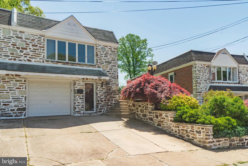 Welcome to this warm & cozy 3 bedroom, 2 bathroom home located in Upper Roxborough! This home features a stone and brick exterior and a fully finished lower level that gets loads of sun. The lower level is perfect for a theater room, home office, guest suite, or home gym.  The main level features an open living/dining room, a beautiful kitchen, tasteful hardwood floors, 3 bedrooms, the main bathroom, and ample natural lighting. This home also has a large backyard with a covered patio, perfect for entertaining. There’s ample parking available, parking for 3 cars in the driveway/garage.  Also, conveniently located near various public transportation routes, including the Manayunk rail line. Enjoy the outdoors by taking a walk through the Wissahickon Valley, or along the Schuylkill River Trail. Roxborough has it all, you'll need to see it to believe it!