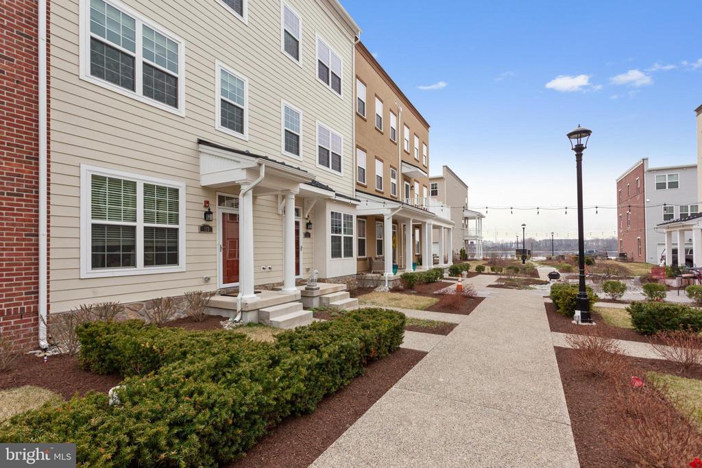 Welcome to Waterside, a desirable recently constructed townhome community located right on the Delaware River front! This 3 bed 2 full bath 2 half bath is an Alexandria Lofts model with an ELEVATOR located on the Mews which is arguably one of the most desirable strips in the community. As you enter your new home the first floor welcomes you with a den/study, a laundry area, and inside access to your 1-car garage. As you walk up the stairs (or ride your elevator) you'll immediately notice the beautiful, spacious kitchen with large peninsula, mocha cabinets, granite counters, and tile backsplash. Off the kitchen is one of two decks that's great for morning coffee. As you pass through the kitchen you have both a dining area and large living space. Take note of the wood flooring, the recessed lighting, and the tasteful accent walls. The 3rd floor is home to two sizable bedrooms with generous closet space (one with an en suite bathroom) + an additional well appointed full bath. The 4th floor is home to the loft which currently acts as a lounge area and play room, but functions well as the master bedroom. Off the loft is your second deck with lovely views of the River (not a bad way to wake up!). This home has many upgrades from the standard (too many to name)and provides quick access to I-95 and Cornwells Heights Train Station making it very convenient for work commutes!