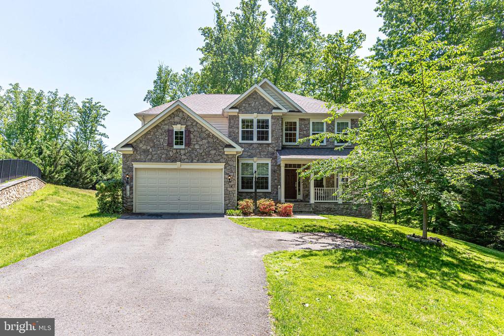 OPEN HOUSE SATURDAY JULY 9th from 2-4 pm!!! Newly priced!! Stunning home in sought-after Jamison’s Farm community. Located in a cul-de-sac, the beautiful stone front elevation and covered front porch welcome you to this gorgeous 4000+ sq ft, property.  The main level features a hardwood floor, recessed lighting, and a 2-story foyer that leads you into a formal dining and sitting room. A private home office, powder room, large family room, gas fireplace, and sunroom bump out are just a few of the home's first-floor amenities. The kitchen is perfect for intimate dinners or entertaining large groups. It features stainless steel appliances, a gas stove granite countertops, a large island, tile backsplash, a walk-in pantry, a double oven, and upgraded cabinetry. 
The spacious sunroom has bar top seating and gorgeous views that lead you to the outside deck. There is also a fully-finished, oversized 2-car garage with plenty of storage space.
The upper level features the primary suite with tray ceiling, sitting room, en suite luxurious bathroom, upgraded tile, dual vanity, granite countertops, separate shower, soaking tub, and a large walk-in closet. The laundry room is conveniently located on the second floor with upgraded cabinets and a utility sink. There are 3 additional bedrooms with great closet space, and a full hall bathroom. The lower level has a large recreation room, full bathroom, large storage area, and fitness room that could easily be converted into the home's 5th legal bedroom.
Close to downtown Warrenton as well as right off Route 29 and 66. Desirable location on the DC side of Warrenton. Historic Old Town Warrenton, shopping, restaurants, and entertainment are all nearby! Don’t miss the opportunity to own this move-in-ready home.
NEWLY PRICED & adding a 10K seller subsidy with a ratified contract before July 8th!!!