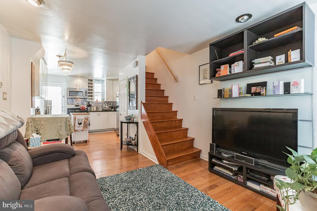 Welcome to this charming 3-story corner apartment in Bella Vista! LOCATION is EVERYTHING!  Enter this home into the open living space and kitchen, which features hardwood flooring, stainless steel appliances, a beautiful light fixture, and a tiled backsplash. Kitchen has a back door which leads to a quaint sitting area outside. The second floor features a den/office space with two windows, large walk in closet, hardwood floors, and a full-sized bathroom with tiling. The third floor features a beautiful bedroom with plenty of space and a unique exposed brick wall with two french doors. This property is conveniently located with plenty of great restaurants, shopping, grocery stores and parks nearby.