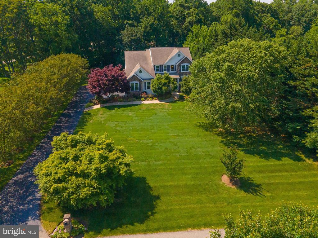Priced to sell. Pool is open! Exquisite home located on private 1 acre lot in the most northern Dunkirk subdivision of Perry's Choice with easy access to Rt.4, DC, Annapolis and Virginia area. Original owners have recently upgraded this home which includes hardwood floors through out,  custom trim, beautiful  gourmet kitchen with granite countertops, ss appliances, wall oven, cooktop, custom cabinets, large pantry and more. Some minor repairs needed. You will love the open floor that is perfect for entertaining, formal dining room & living room, main level office, plantation shutters, New windows about 3 yrs. old, 2 zoned hvac about 5yrs. old. Spacious owners suite including gorgeous renovated owners bath with heated floors. 3 additional bedrooms on upper level including one bedroom with it's own full bath, and additional full bath in hallway for a total of 3 full baths on upper level. Finished walkout  lower level  includes great room, workout room, and bedroom with full bath. 2 car garage with charging station. Step outside to enjoy your heated salt water pool (2016) with waterfalls all located in private setting. Acreage to the right of the home is community common area which offers you extra privacy. Seller prefers 30 day rent back.