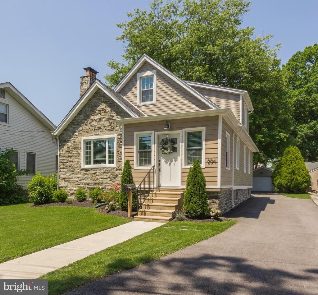 This classic home has been remodeled from top to bottom. Enter through a tiled sun porch into the living room featuring white oak floors and a natural stone fireplace with a gas insert. Friends and family gather in the dining area while the cook is in the dream kitchen featuring soft-close white cabinets, granite countertops, and stainless steel appliances (gas cooking). Step out the back door to a flagstone landing and walkway. Mature trees grace the backyard, where you will find your detached garage. The lower level of the home features a 19 x 24 great room, possible 4th bedroom/office, utility room, large laundry room, and convenient powder room. The 2nd floor is dedicated to the main bedroom suite featuring pocket doors, a large, custom tile bath, and a walk-in closet with built-in seating. This light-filled home features a newer roof, siding, windows, doors, trim, flooring, and mechanics, all replaced in 2020! The total finished square footage is approximately 2,021 (please confirm your own measurements).