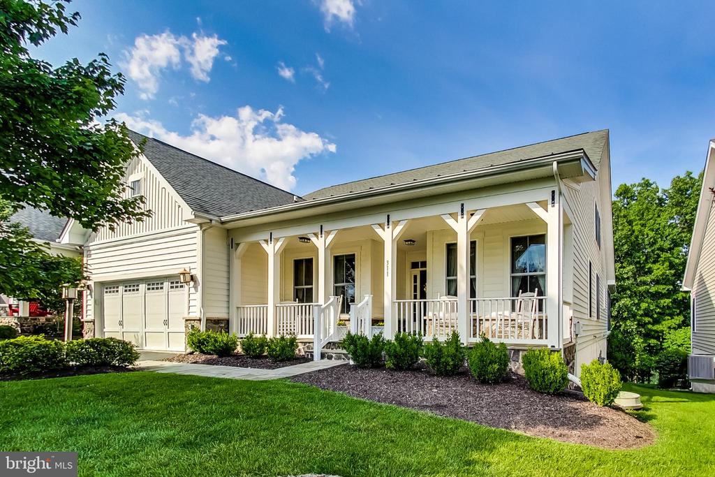 Stunning, spacious home in PREMIER, GATED, ACTIVE 55+ COMMUNITY! BACKS TO THE LAKE! This vibrant community is an active lifestyle, resort community surrounding a 117-acre lake. Shenandoah has its own award-winning restaurant w/lounge and a downstairs game area with billiards, shuffleboard, golf simulator & more. There is an Arts & Exploration Studio for crafts, an onsite athletic club, an indoor/outdoor pool, cooking classes, picnic areas & much more! Close to golf courses, & convenient to restaurants, shopping, and museums. This sunlit home features over 3,600 square feet of living space. Gorgeous, slate front porch, gleaming hardwood floors throughout the main level, 2 main level bedrooms including the 17'x16' owner's suite with dual walk-in closets and a luxury ensuite bathroom with an oversized, double bowl vanity, soaking tub, and separate shower. French doors open from the foyer to the private den or office. The great room features a soaring 2-story, vaulted ceiling, and built-ins on either side of the dramatic floor-to-ceiling, stone fireplace. The great room flows into the kitchen with ample cabinet & counter space, a center island w/ a breakfast bar, and a breakfast bay. Enjoy the tranquil lake views from the screened porch or rear deck. Convenient main level laundry room w/ a door to the garage. Upstairs you'll find a full bathroom, a 20' x 16' loft, a den or storage room, and an additional bedroom with a wall of closet space. The finished walk-out basement offers an expansive, open 47’x 25’ rec room with atrium doors to the patio and a second fireplace. Lower-level 4th full bathroom, a den (could be used as a BR), and plenty of storage space. PREPARE TO FALL IN LOVE WITH THIS HOME AND THIS COMMUNITY!