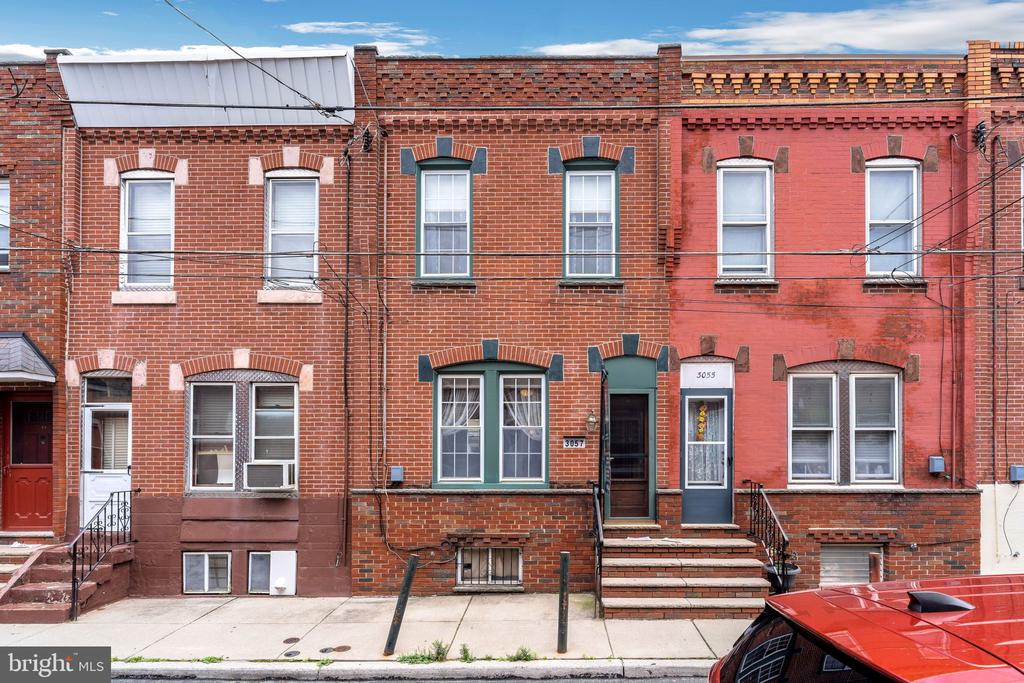 Welcome to 3057 Mercer Street, located in the heart of Port Richmond which is a traditional Philly row home community that is rated as one of the top housing markets.   A beautifully maintained brick front home with  3 beds, 1 full bath located on a quiet, neighbor friendly street.   Enter the home through the vestibule into the large open living room with hardwood floors, high ceilings and a ceiling fan.   The large window in the front of the house, brings in lots of natural light throughout the day.  Off of the living room is the dining room which enters into the updated kitchen featuring corian counter tops, tile backsplash, range/ oven, refrigerator, dishwasher and plenty of counter top prep space.  Upstairs features 3 bedrooms and a full bath.    The primary bedroom is in the front of the house and has a nice large closet and ceiling fan.    New central air was installed in 2019, new roof in 2020 and laundry is in the unfinished basement.   Close to school and shopping.   Schedule your showing today.