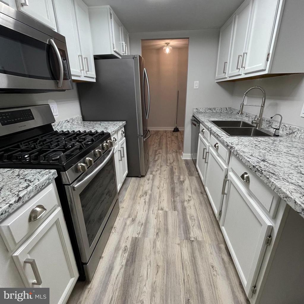 Welcome to Chester County! This beautiful fully renovated 2-bedroom, 2-bath condo is located in Tredyffrin Twp and has so much to offer. Situated not only in the middle of the township but also on a golf course! This property is conveniently located near major highways and the highly sought-after Tredyffrin/Easttown school district. Enter through the brick exterior to a lovely kitchen and living area. The kitchen offers beautiful wooden cabinets, stainless steel appliances, and plenty of counter space. Large sliding glass doors in the living room let in ample light and lead to an outdoor balcony perfect for entertaining. The main bedroom is spacious and offers a full bathroom. The second bedroom is also a great size and a second bathroom can be found in the hallway. The building is surrounded by well-groomed landscaping and greenery and has excellent curb appeal.