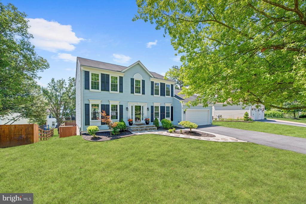 Stunning colonial on a spacious cul-de-sac lot settled amongst mature trees ideal for the outdoor enthusiast offering walking and bicycling trails, Patapsco State Park,  and beautiful landscaping that guides you into the rear fenced yard with a salt-water in-ground pool for entertaining family and friends!  Arrive into the foyer and experience gorgeous hardwood floors that continue into the living and dining areas that compliment the crown molding, chair railing, and custom blinds.  Let the gourmet kitchen inspire delectable delights boasting octagon Italian tile flooring, a center island with breakfast bar and pendant lighting, 42” shaker style cabinetry, Chicago brick backsplash, stainless steel appliances, and leathered granite counters. The spacious family room adjacent to the family room offers a neutral color palette that highlights the vaulted ceilings, a brick surround wood-burning fireplace with a dentil molding accented mantle, and access to the sizable deck for easy indoor and outdoor living.  Relax and unwind in the tranquil, spa-like primary bedroom suite featuring plush carpet, a walk-in closet with custom organizing system, double vanity, and a subway tile glass door walk-in shower.  Three additional bedrooms and a hall bath complete the upper level sleeping quarters.  Possibilities are endless in the fully finished lower level that provides a spectacular space for spending time with loved ones accented by modern tile, a full bath, exercise room, bedroom, and access to the patio and lounge areas.  Major commuter routes include I-70, US-40, I-695, and I-95.  An abundance of upgrades and updates such as a French Drain, Lower Level Carpet and Paint, Sump Pump, Garage Shelving, Primary Bedroom Suite Bath, Kitchen, Washer, Dryer, Pool Pump, In-Ground Pool Converted To Salt Water, Italian Tile Flooring, Lower Level Bath, Upper-Level Bath, Deck, Garage Door, Kitchen Window Shades, Interior & Exterior Paint, Deck Paint, Sliding Door To Patio, make this an exquisite, must see property!