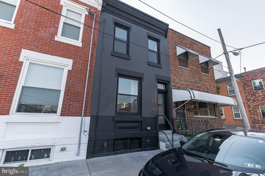Welcome to Passyunk Square, and to 1435 South Percy Street! Close proximity to Center City, University City, The Navy Yard, FDR Park, The Stadium District, and Southern NJ. Walking distance to East Passyunk Avenue, Columbus Square Park, South 9th Street Italian Market, and the Broad Street Line. Everything has been taken care of in this fantastic, 2-story, brick, Philadelphia straight-through row home on a super-convenient street in South Philadelphia, and it comes with the following: Great room connected to a modern/open dining area and kitchen; modern half bathroom on 1st floor; modern full bathroom on 2nd floor with large format European tile design; 3 spacious bedrooms; and a private outdoor space. The amazing kitchen features a light + dark contrast between the cabinetry and quartz countertops, large island, stainless steel appliances, range hood, brass hardware, tile backsplash, contemporary pendant lights, and an open/light-filled workspace. The modern floor plan has hardwood floors + great natural light, as well as easy living/entertaining options, where you can enjoy Philadelphia's four traditional seasons in the rear outdoor space or on your classic soapstone stoop. You can choose to walk, bike, use public transit, or drive on a daily basis. This ideal + convenient location also allows you to walk, run, and bike on the Schuylkill River Trail, or on the Delaware River Trail directly alongside the vast Delaware River, just a short distance from your front door. 1435 South Percy Street provides a charming, historic, urban lifestyle, with convenient access to Philadelphia's great restaurants, shops, recreation, and history!