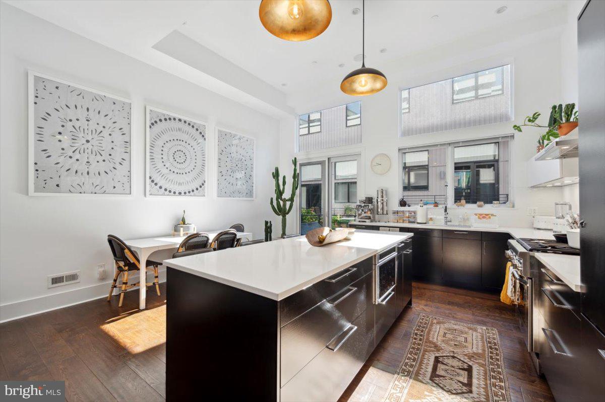 Welcome to this luxurious, gated community in Northern Liberties! Built approximately 6 years ago, this home has about 4 years remaining on the TAX ABATEMENT! Take a cobblestone path to the front door of this 3,100+ square foot home and enter into a spacious living room, with 14’ ceilings, a double coat closet, a powder room and tons of natural light. Take note of the stunning wide-plank hardwood floors, Pella Architect Series windows, 4" recessed LED lighting, built-in Sonos speakers, floating staircase and split floors covering 6 levels. The stylish, sleek kitchen includes Thermador Professional appliances, fine cabinetry, under cabinet lighting, and high-end quartz countertops. The upper levels include 3 large in suite bedrooms with tons of closet space and tasteful bathrooms with floor-to-ceiling tile and superior fixtures. Enjoy stunning views of the city skyline from the ROOF DECK with built-in green space! The lower level includes a finished basement, as well as a flex space. Last but not least, this home has an oversized 2-CAR GARAGE attached! The affordable HOA covers common area maintenance and snow removal. This home is conveniently located near various public transportation routes, including the MFL rail line, and is within walking distance to popular attractions, including North Bowl, Cafe La Maude, La Colombe, Liberty Lands Park, Laser Wolf, Target, City Fitness, Frankford Hall, and much more! Don’t miss out on this one-of-a-kind home – schedule a showing today!