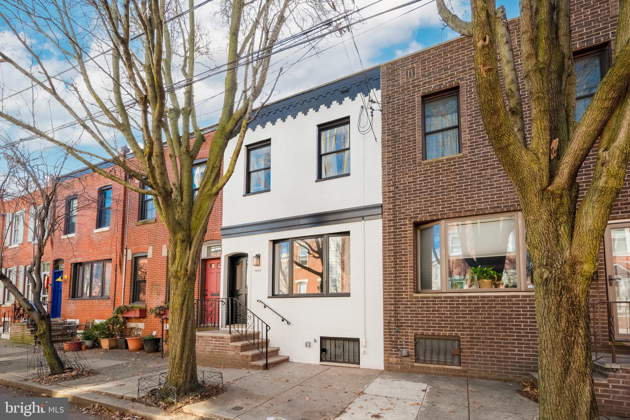 Welcome to the heart of Passyunk Square!!! Enter through the living room of this beautifully-remodeled home into the open living space, which features tasteful hardwood floors, a powder room, recessed light fixtures and ample natural lighting. The unique kitchen includes quartz countertops, a gas stove, custom backsplash, and stainless steel appliances. Out back, you will find a spacious patio, perfect for grilling and al fresco dining. Upstairs, there are three bedrooms, with recessed lighting and ceiling fans, as well as a full bathroom with custom floor-to-ceiling tiling. The basement includes the laundry area and is perfect for additional storage and/or a home gym. Located just a couple blocks from the famous Green Eggs Cafe and Victor Cafe. A short walk from the Italian Market and Passyunk Square business/dining corridor, where you can find great shops and restaurants including Urban Jungle, POPE, Black N Brew, and Barcelona Wine Bar. Also, conveniently located near various public transportation routes, including SEPTA's Broad St line. A beautifully remodeled home, on a low traffic block, just off Columbus Park equipped with a 10 year tax abatement! Don’t miss out – schedule a showing today! Agents have an ownership interest in the property.