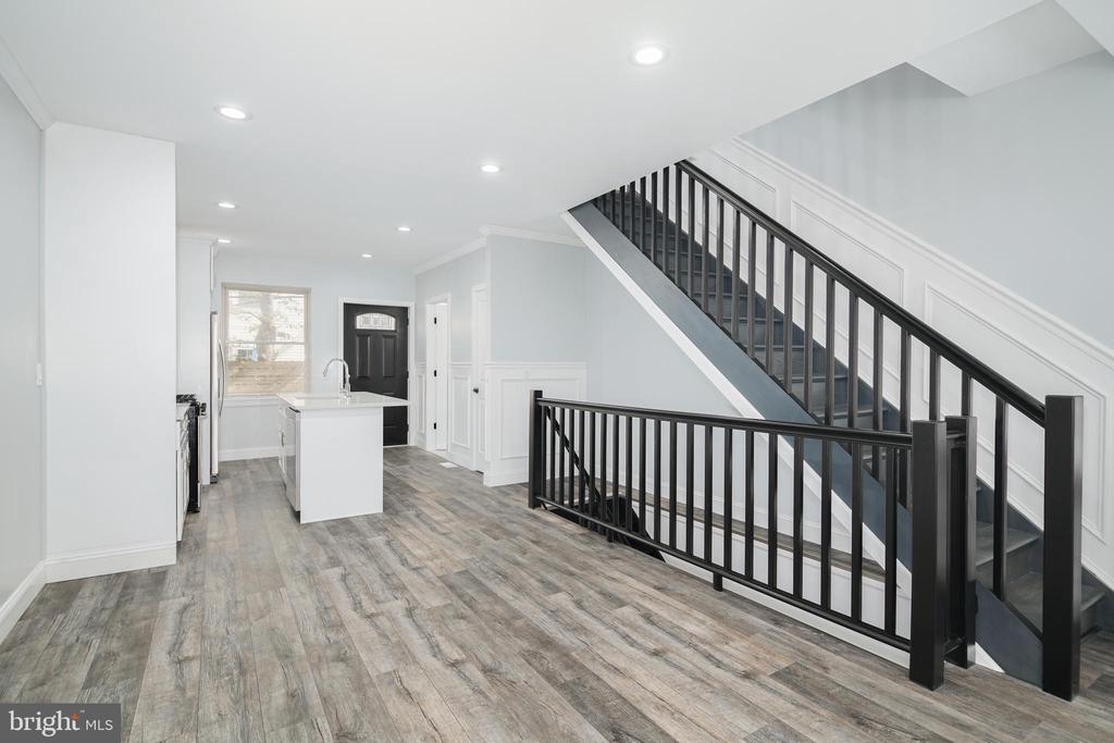 Currently offer with 6% Seller Assist .welcome home to this recently renovated modern home. This home welcomes you with a bright and open floor plan equipped with plenty of living space to suit all of your needs The dining and kitchen area offers an open concept throughout the entire first floor. The eat in kitchen features stainless  steel appliances, custom backsplash, and plenty of cabinet storage space .  Second floor you have two generous sized bedrooms ,full bathroom and a convenient laundry room. As you continue to the third floor you will notice your own personal oasis which consist of a luxurious  ensuite fully equipped  with a soaker tub, real marble counters and double vanity and rain fall shower; The primary bedroom welcomes you with a sunlight bedroom and a walk in closed. Additional this home is complete with a spacious rooftop deck and a beautiful unobstructed Center City View. This home offers a fully finish basement.