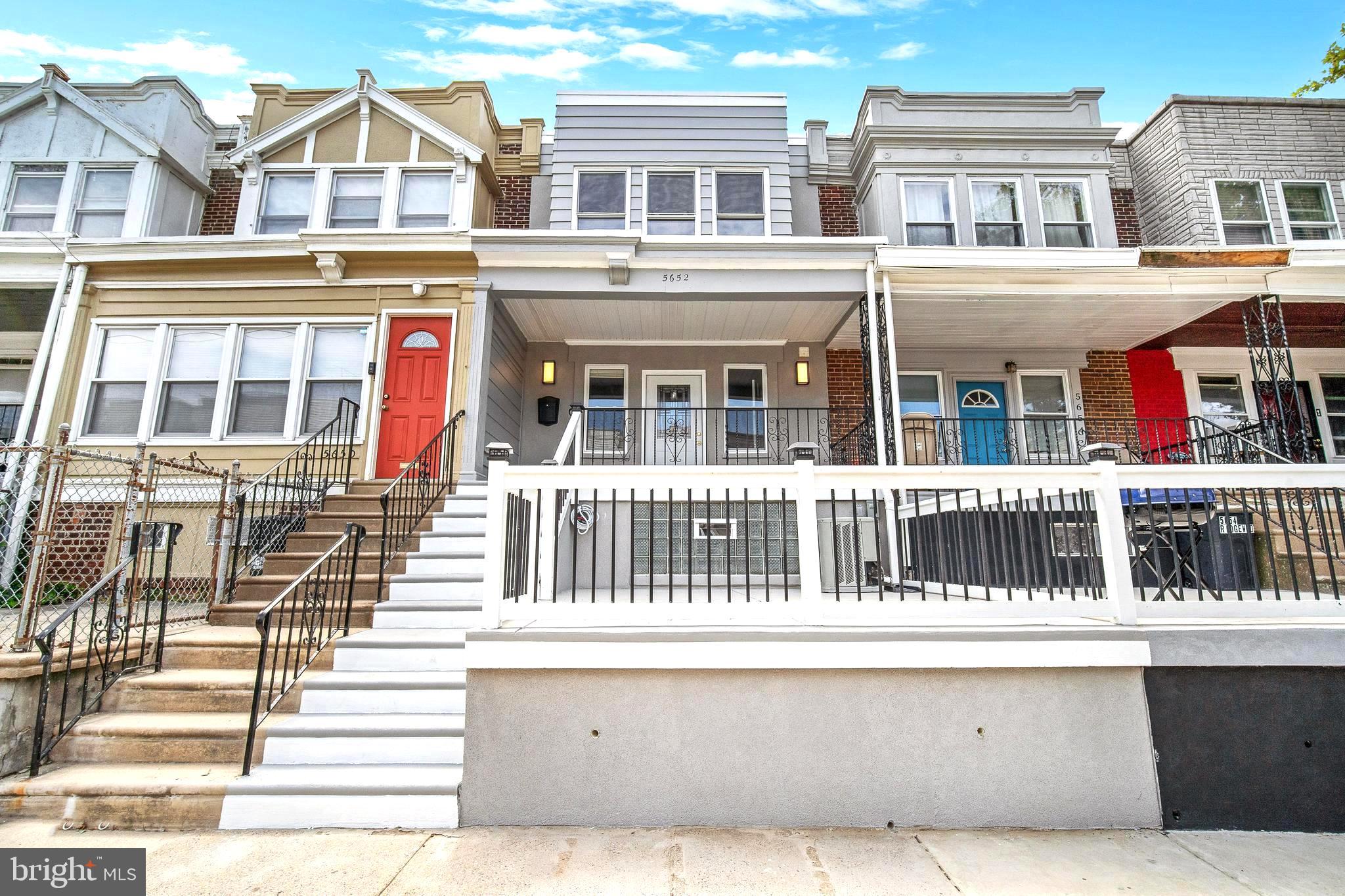 Welcome to Kingsessing, and to 5652 Ridgewood Street! Close proximity to University City, Center City, Bartram's Garden, and Fairmount Park. Walking distance to Baltimore Ave, Cobbs Creek Park, and the 49th Street Train Station; as well as many convenient trolley routes along Chester Ave. Move right in to this fully rehabbed, 2-story, Philadelphia straight-through row home, which comes with the following: living room; dining room; fireplace; open kitchen; modern half bathroom on 1st floor; 1 modern full bathroom on 2nd floor; 3 spacious bedrooms; fully finished basement  w/ full bathroom; amazing rear deck. The kitchen features stone countertops, stainless steel appliances, and large island. The entire home has hardwood floors + great natural light. You can choose to walk, bike, use public transit, or drive on a daily basis. This ideal + convenient location also allows you to walk, run, and bike in Cobbs Creek Park, or directly into the lush green trails along Bartram's Garden just minutes from your front door. 5652 Ridgewood Street provides a charming, historic, neighborhood lifestyle, with convenient access to Philadelphia's greater restaurants, shops, recreation, and history!