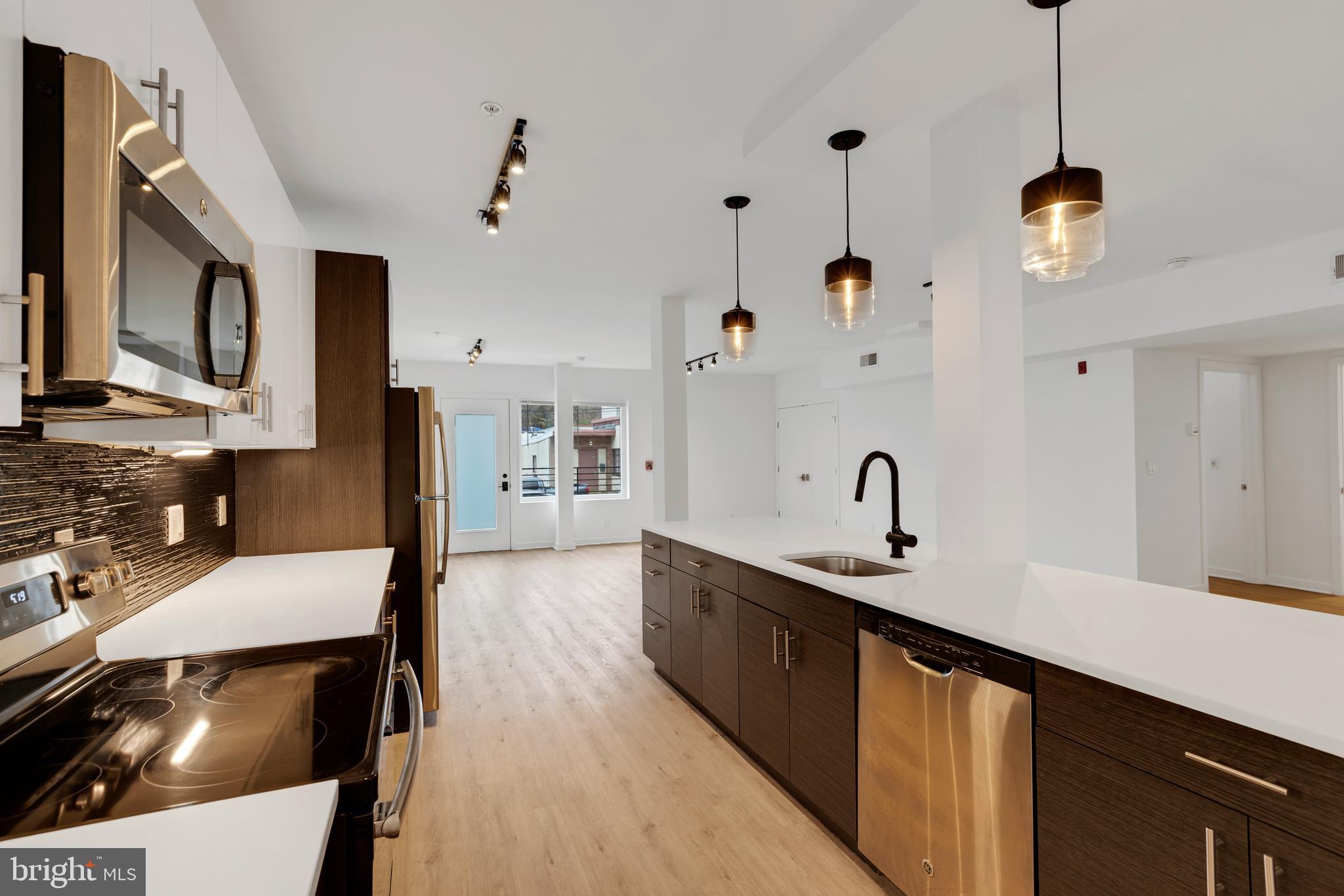Welcome to Manayunk, and to 227 Krams Avenue! Close proximity to Manayunk, Chestnut Hill, Fairmount Park, Center City, Conshohocken, and King of Prussia. Walking distance to Pretzel Park, Main Street in Manayunk, Ridge Avenue Business District in Roxborough, and the Manayunk Train Station; as well as many convenient bus routes along Ridge Ave. Move right in to this contemporary, open-floor-plan apartment, which comes with the following: great room; modern kitchen; modern full bathroom; 2 spacious bedrooms; washer/dryer; and a fantastic roof deck with 360 degree views. The kitchen features stone countertops, stainless steel appliances, and a light-filled workspace. This unit has hardwood floors + great natural light, as well as easy living/entertaining options, where you can enjoy Philadelphia's four traditional seasons on the large roof deck. You can choose to walk, bike, use public transit, or drive on a daily basis. This ideal + convenient location also allows you to walk, run, and bike on the Manayunk Tow Path, or directly into the lush green trails of the Wissahickon Valley, just minutes from your front door. 227 Krams Avenue provides a charming, historic Main Street lifestyle, with convenient access to Philadelphia's great restaurants, shops, recreation, and history!